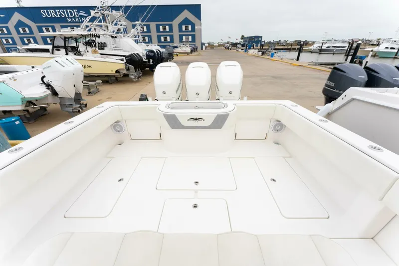 Yacht Photos Pics 2019 Invincible 39 Open Fisherman boat at Sureside Marina, featuring triple outboard engines.