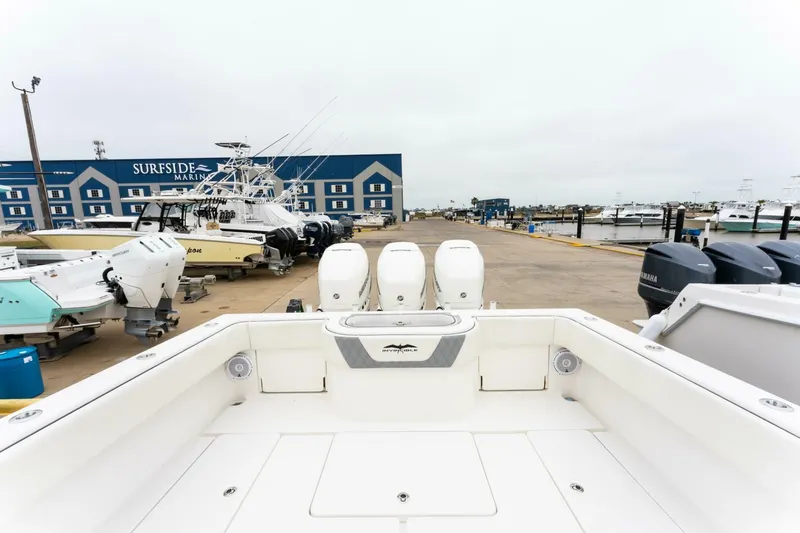  Yacht Photos Pics 2019 Invincible 39 Open Fisherman boat at marina, featuring triple outboard engines.
