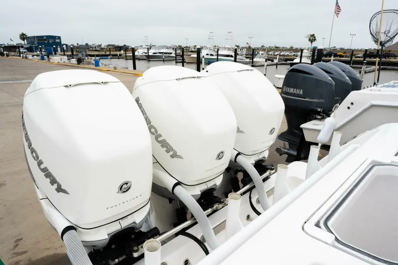  Yacht Photos Pics Four powerful outboard engines on a 2019 Invincible 39 Open Fisherman boat at a marina.