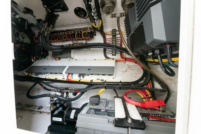  Yacht Photos Pics Electrical system of a 2019 Invincible 39 Open Fisherman boat, showcasing wiring and components.