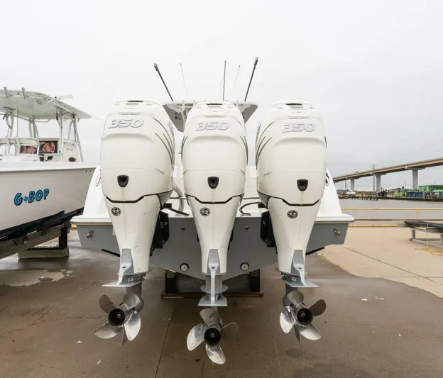  Yacht Photos Pics 2019 Invincible 39 Open Fisherman with triple 350 engines, docked on a cloudy day.