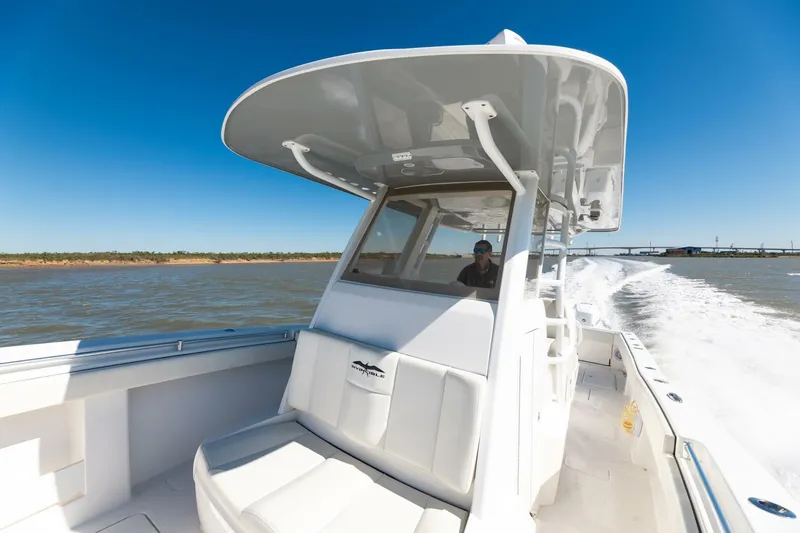  Yacht Photos Pics 2019 Invincible 39 Open Fisherman boat cruising on open water under clear blue sky.