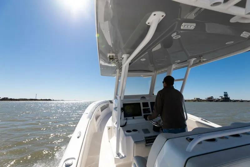  Yacht Photos Pics 2019 Invincible 39 Open Fisherman boat cruising on sunny waters.