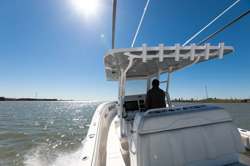  Yacht Photos Pics 2019 Invincible 39 Open Fisherman boat cruising on sunny waters.