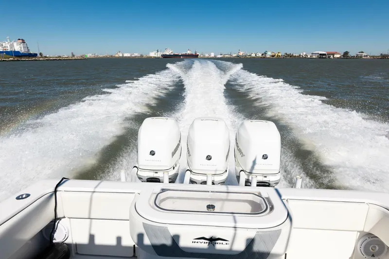  Yacht Photos Pics 2019 Invincible 39 Open Fisherman boat cruising with powerful engines on open water.