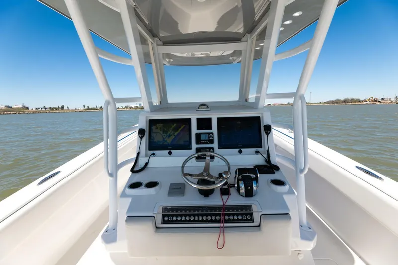  Yacht Photos Pics 2019 Invincible 39 Open Fisherman boat console with dual screens and steering wheel.