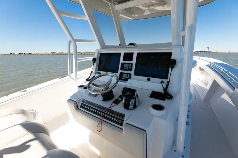  Yacht Photos Pics 2019 Invincible 39 Open Fisherman boat console with dual screens and steering wheel.