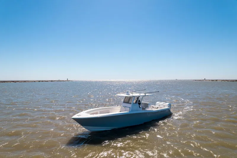  Yacht Photos Pics 2019 Invincible 39 Open Fisherman boat on open water under clear blue sky.