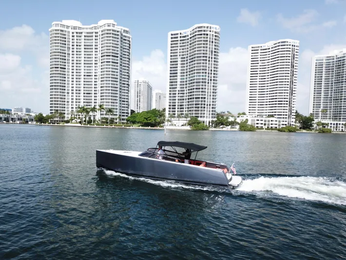  Yacht Photos Pics VanDutch 30 boat cruising near waterfront skyscrapers, 2016 model.