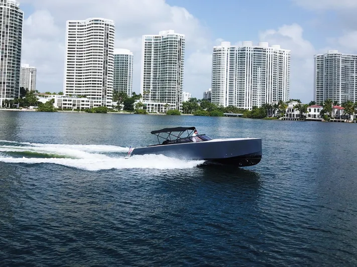  Yacht Photos Pics VanDutch 30 boat cruising near modern high-rise buildings, 2016 model.