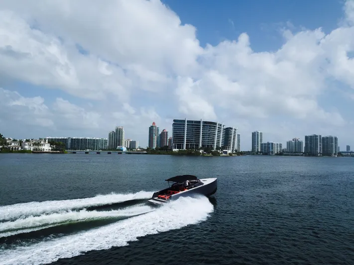  Yacht Photos Pics VanDutch 30 yacht cruising near city skyline under cloudy sky, 2016 model.