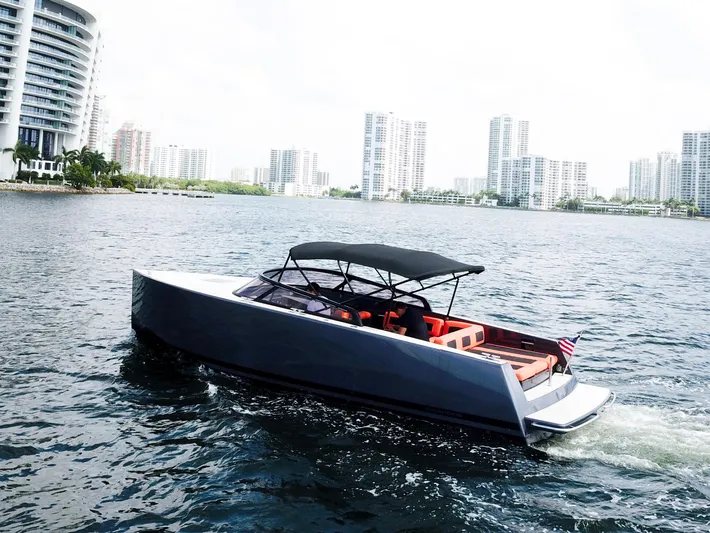  Yacht Photos Pics 2016 VanDutch 30 yacht cruising near modern city skyline.