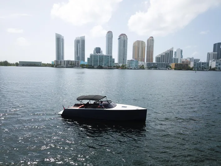  Yacht Photos Pics VanDutch 30 boat on water with city skyline in background, 2016 model.