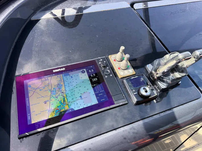  Yacht Photos Pics Control panel of a 2016 VanDutch 30 yacht with navigation display and controls.