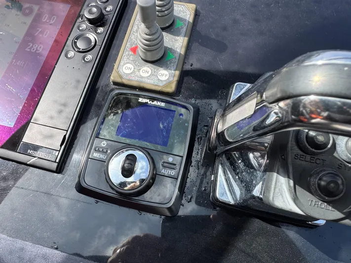 Yacht Photos Pics Control panel of a 2016 VanDutch 30 boat with navigation and throttle controls.