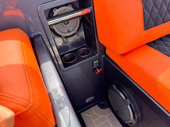  Yacht Photos Pics Interior of 2016 VanDutch 30 boat with orange seating and speaker system.