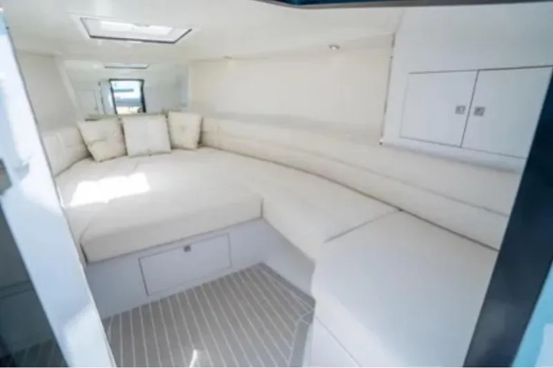  Yacht Photos Pics Luxurious interior of 2016 VanDutch 30 yacht with plush white seating.