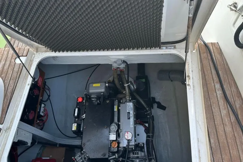 Picota Yacht Photos Pics Engine compartment of a 2018 Lagoon 42 catamaran, showcasing mechanical components and wiring.