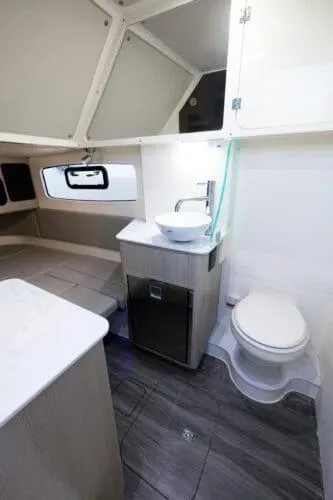  Yacht Photos Pics 2026 Scout 357 LXF boat interior with modern bathroom amenities and sleek design.