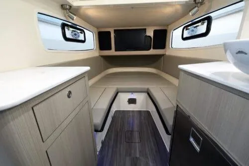  Yacht Photos Pics Interior of 2026 Scout 357 LXF boat, featuring modern cabinetry and seating.