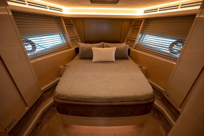 Five Weeks Yacht Photos Pics Luxurious 2019 Monte Carlo Yachts MCY 66 cabin interior with elegant bedding and ambient lighting.