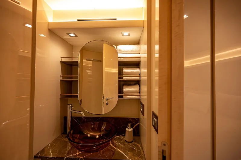 Five Weeks Yacht Photos Pics Luxurious bathroom on 2019 Monte Carlo Yachts MCY 66 with elegant sink and modern design.