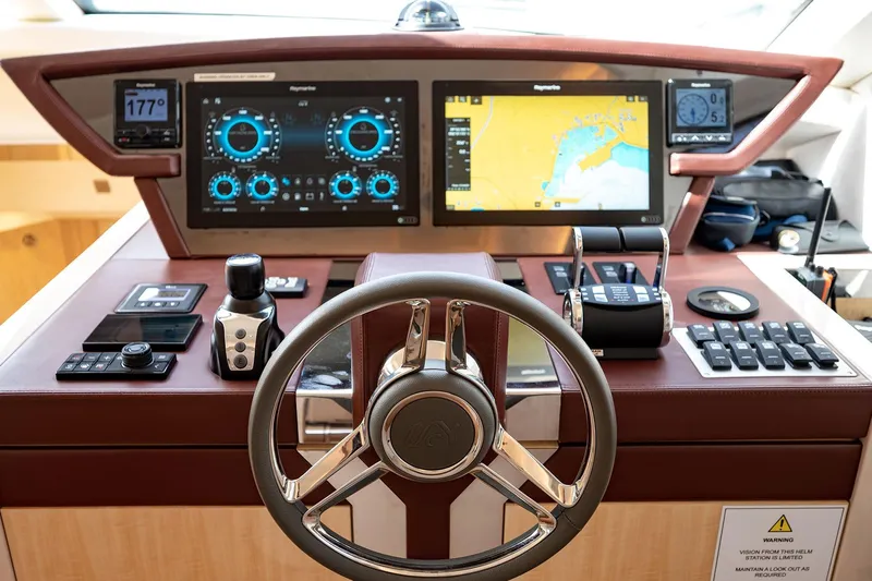 Five Weeks Yacht Photos Pics 2019 Monte Carlo Yachts MCY 66 helm with advanced navigation displays and controls.