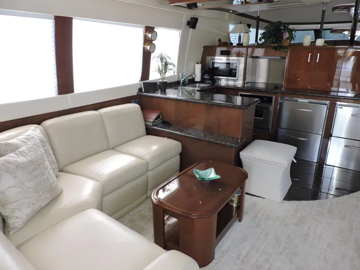  Yacht Photos Pics Luxurious interior of 2010 Carver 56 Voyager SE yacht with modern kitchen and seating area.