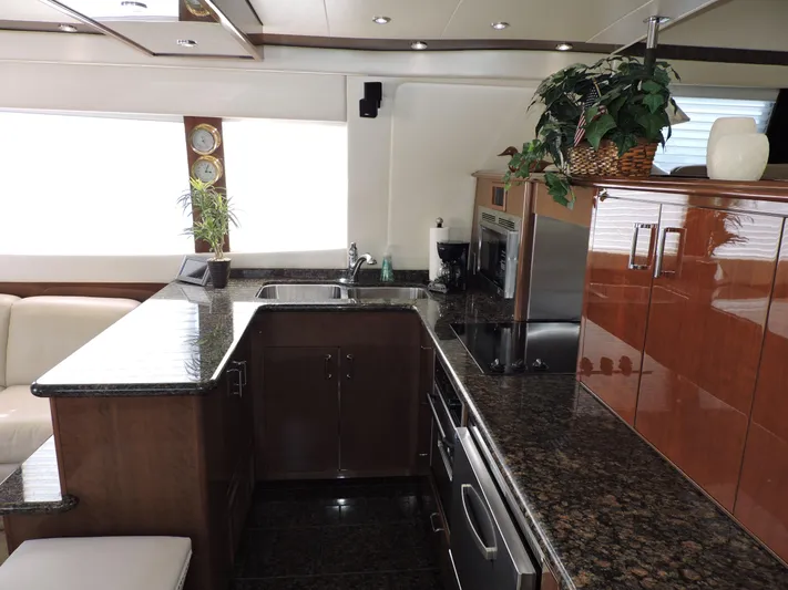  Yacht Photos Pics Luxurious kitchen interior of 2010 Carver 56 Voyager SE yacht with granite countertops.