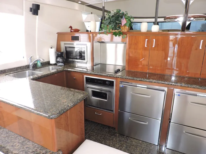  Yacht Photos Pics Luxurious kitchen interior of 2010 Carver 56 Voyager SE yacht with modern appliances.