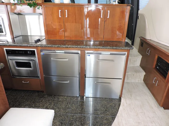  Yacht Photos Pics Luxurious kitchen interior of 2010 Carver 56 Voyager SE yacht with stainless steel appliances.