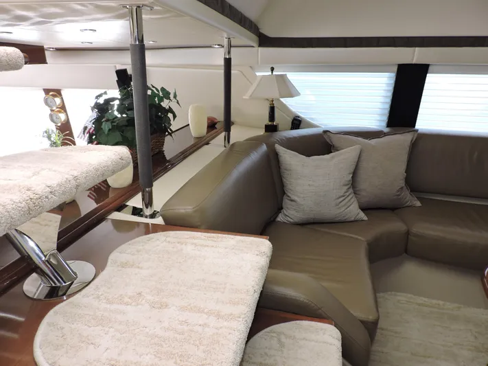  Yacht Photos Pics Luxurious interior of 2010 Carver 56 Voyager SE yacht with plush seating and elegant decor.