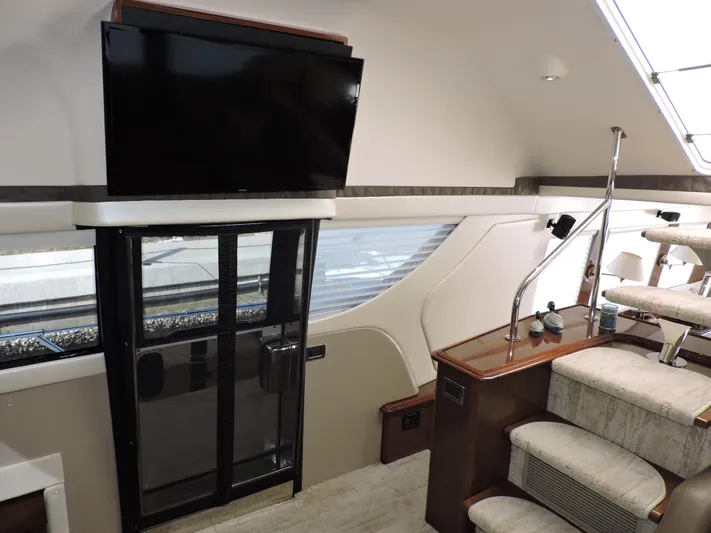  Yacht Photos Pics Interior of 2010 Carver 56 Voyager SE yacht with TV and staircase.