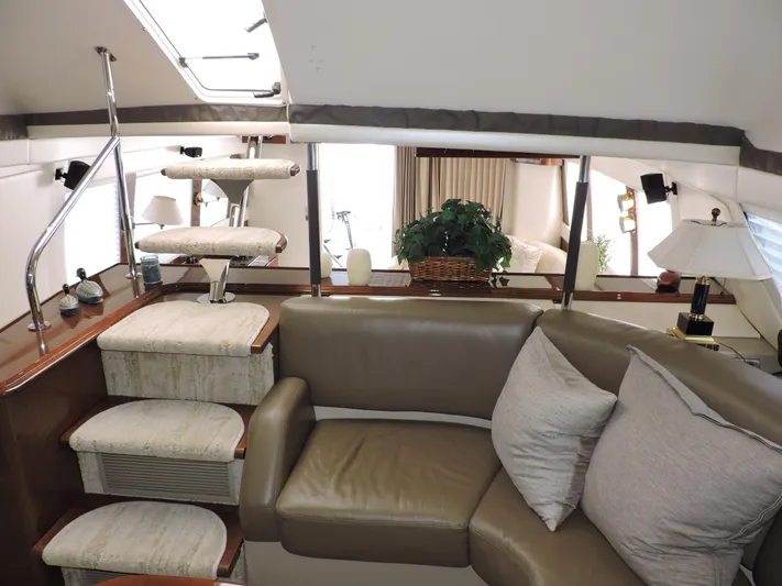  Yacht Photos Pics Luxurious interior of 2010 Carver 56 Voyager SE yacht with plush seating and elegant decor.