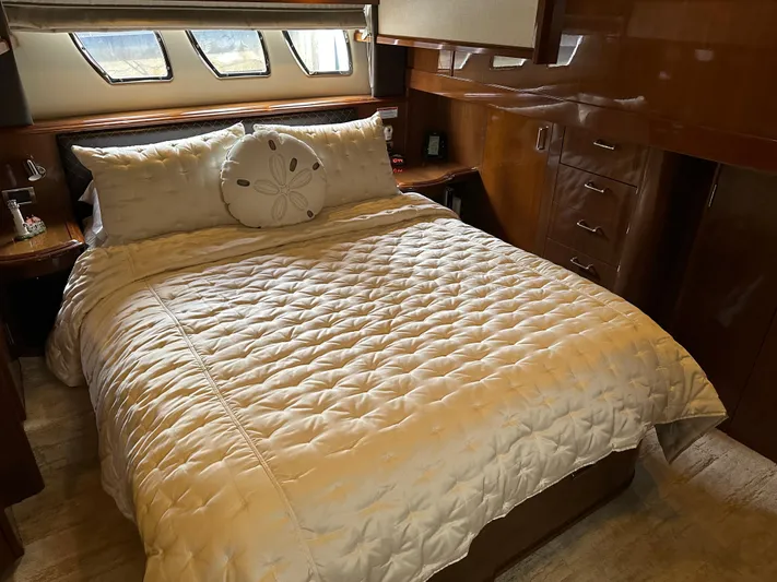  Yacht Photos Pics Luxurious bedroom interior of 2010 Carver 56 Voyager SE yacht with elegant bedding.