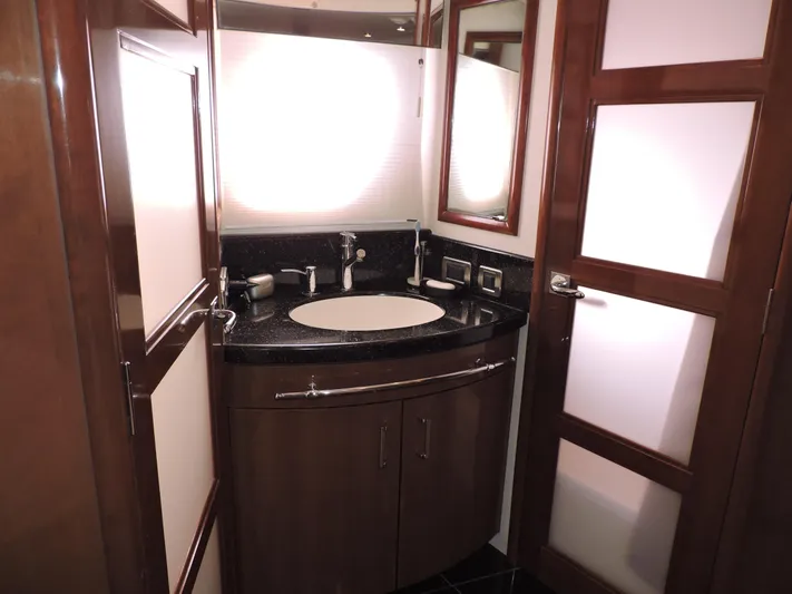  Yacht Photos Pics Luxurious bathroom in 2010 Carver 56 Voyager SE yacht with modern fixtures and elegant design.