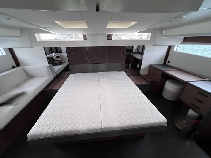  Yacht Photos Pics Luxurious interior of 2024 Beneteau M 48 yacht with spacious bed and modern furnishings.