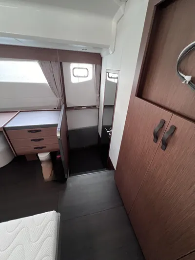  Yacht Photos Pics 2024 Beneteau M 48 yacht interior with modern wood finishes and ample natural light.