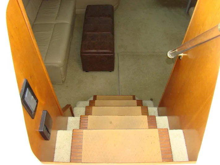 Cramitall Inn Yacht Photos Pics Staircase leading to the interior of a 2004 Cruisers 455 Express Motoryacht.