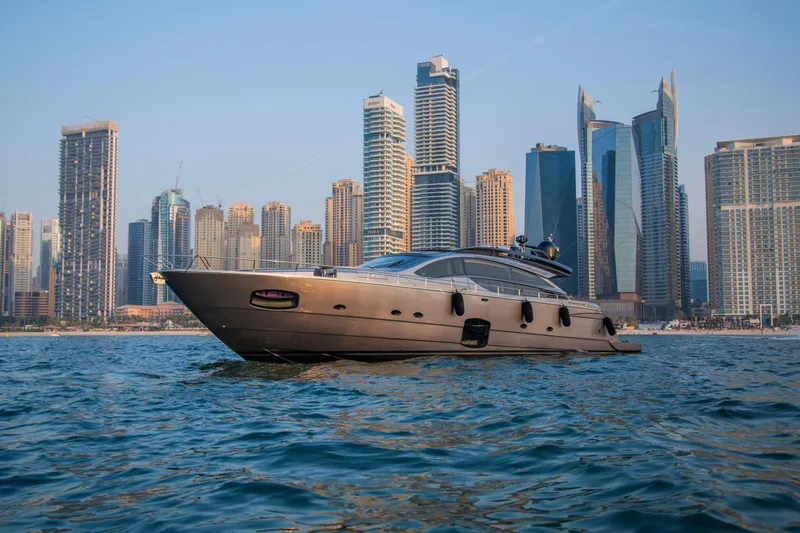  Yacht Photos Pics Luxurious 2016 Pershing 82 yacht cruising near modern city skyline.