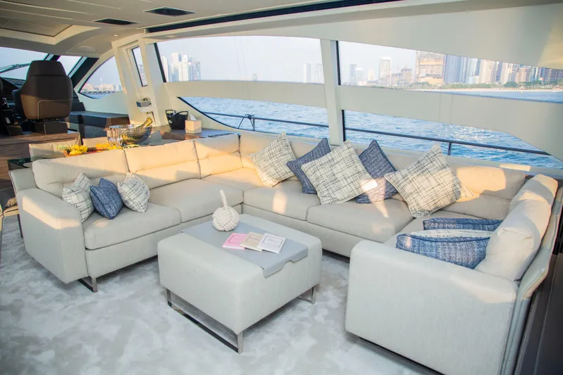 Yacht Photos Pics Luxurious interior of 2016 Pershing 82 yacht with elegant seating and ocean view.