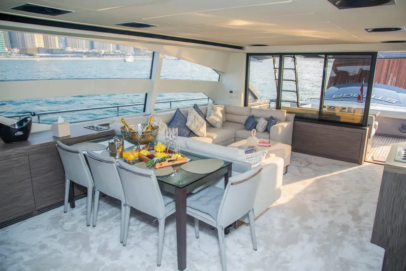  Yacht Photos Pics Luxurious interior of 2016 Pershing 82 yacht with elegant dining and seating area.