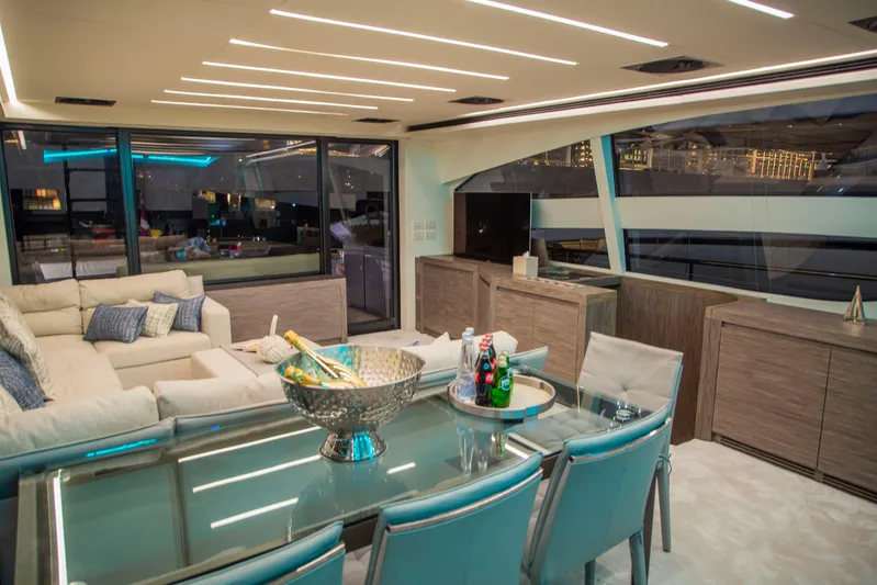  Yacht Photos Pics Luxurious interior of 2016 Pershing 82 yacht with modern seating and dining area.