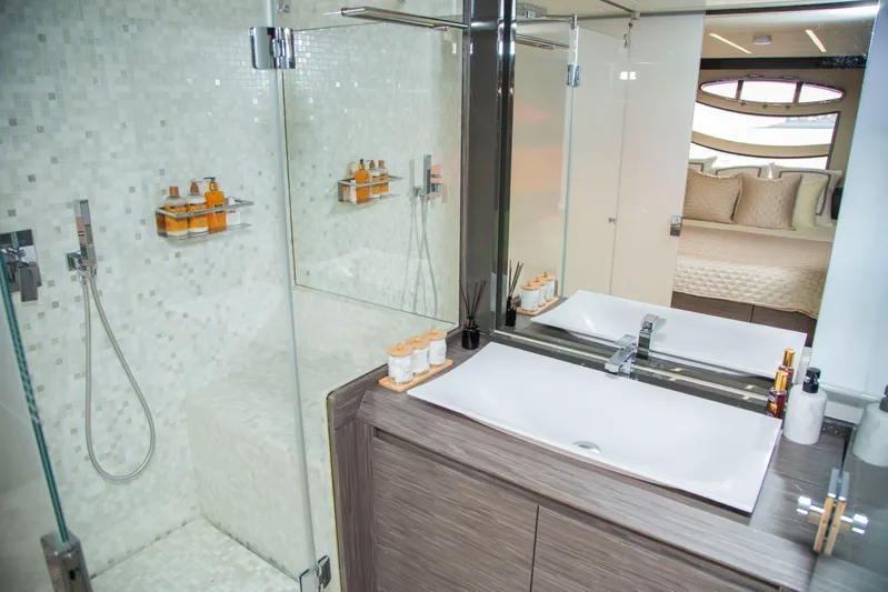  Yacht Photos Pics Luxurious bathroom in 2016 Pershing 82 yacht with modern fixtures and elegant design.