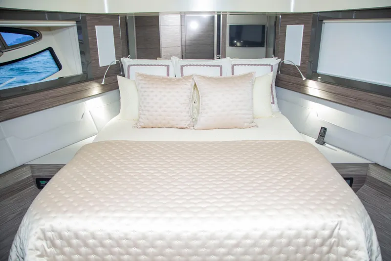  Yacht Photos Pics Luxurious bedroom interior of 2016 Pershing 82 yacht with elegant bedding and modern design.