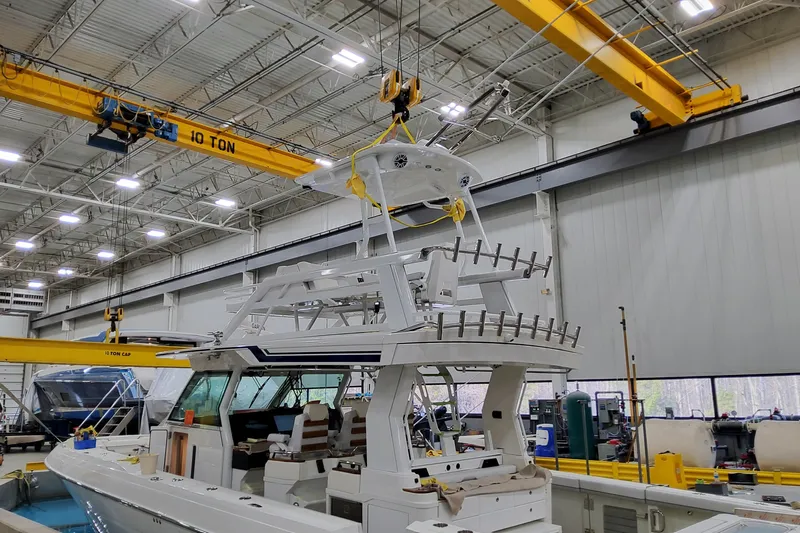  Yacht Photos Pics 2026 Formula 457 Center Console Fish boat under construction in a factory setting.