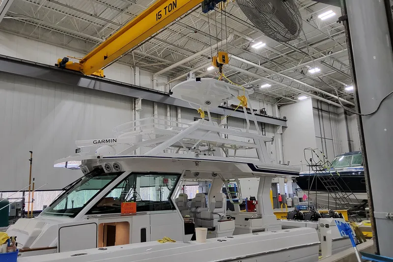  Yacht Photos Pics 2026 Formula 457 Center Console Fish boat under construction in a factory setting.