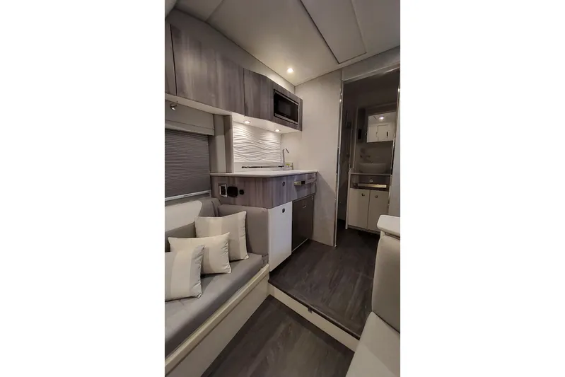  Yacht Photos Pics Interior of 2026 Formula 457 Center Console Fish boat with modern kitchen and seating area.