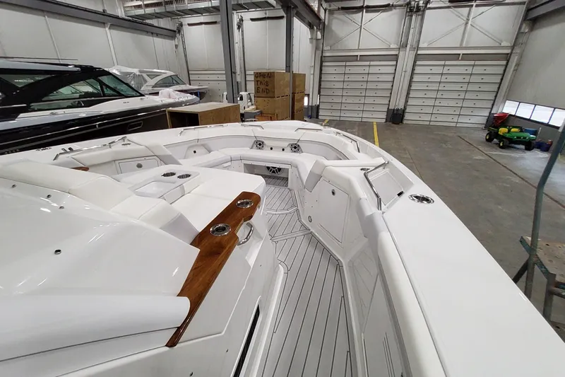  Yacht Photos Pics 2026 Formula 457 Center Console Fish boat interior in a spacious warehouse setting.