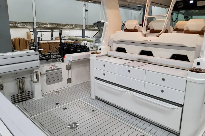  Yacht Photos Pics 2026 Formula 457 Center Console Fish boat interior with seating and storage compartments.